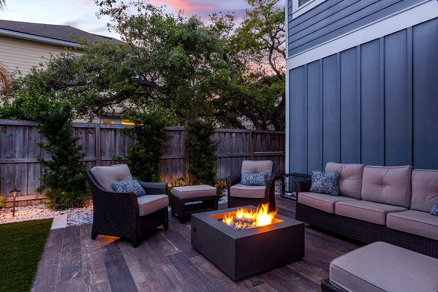 Modern outdoor furniture and a fireplace on the deck of a home in Springfield, IL.